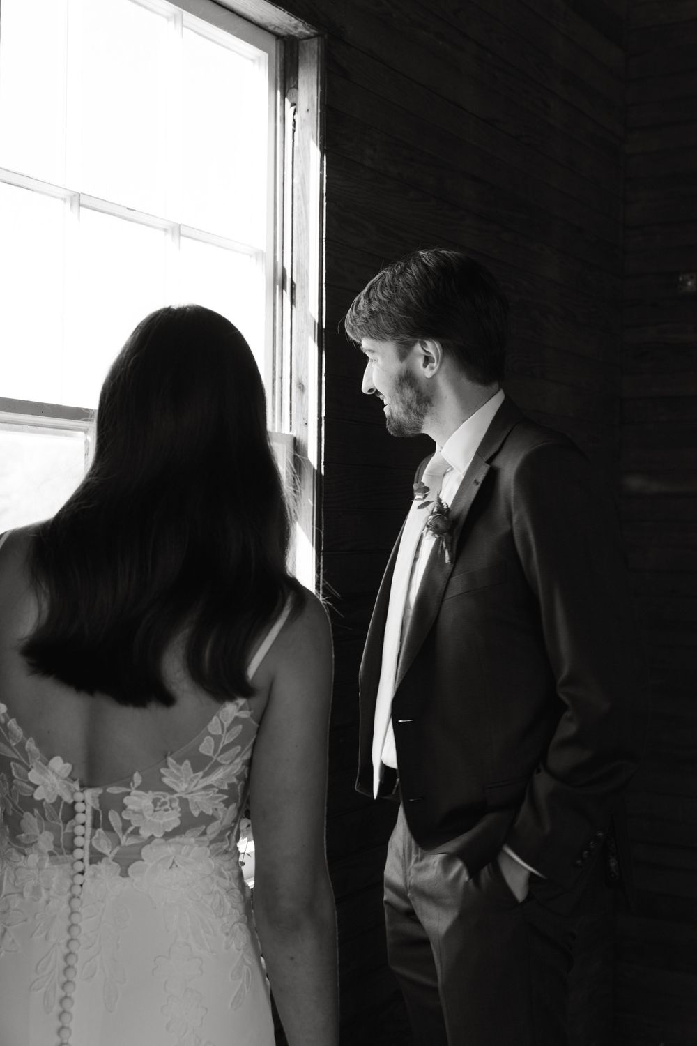 A series of black and white photos showing a couple in formal attire standing together near a window.