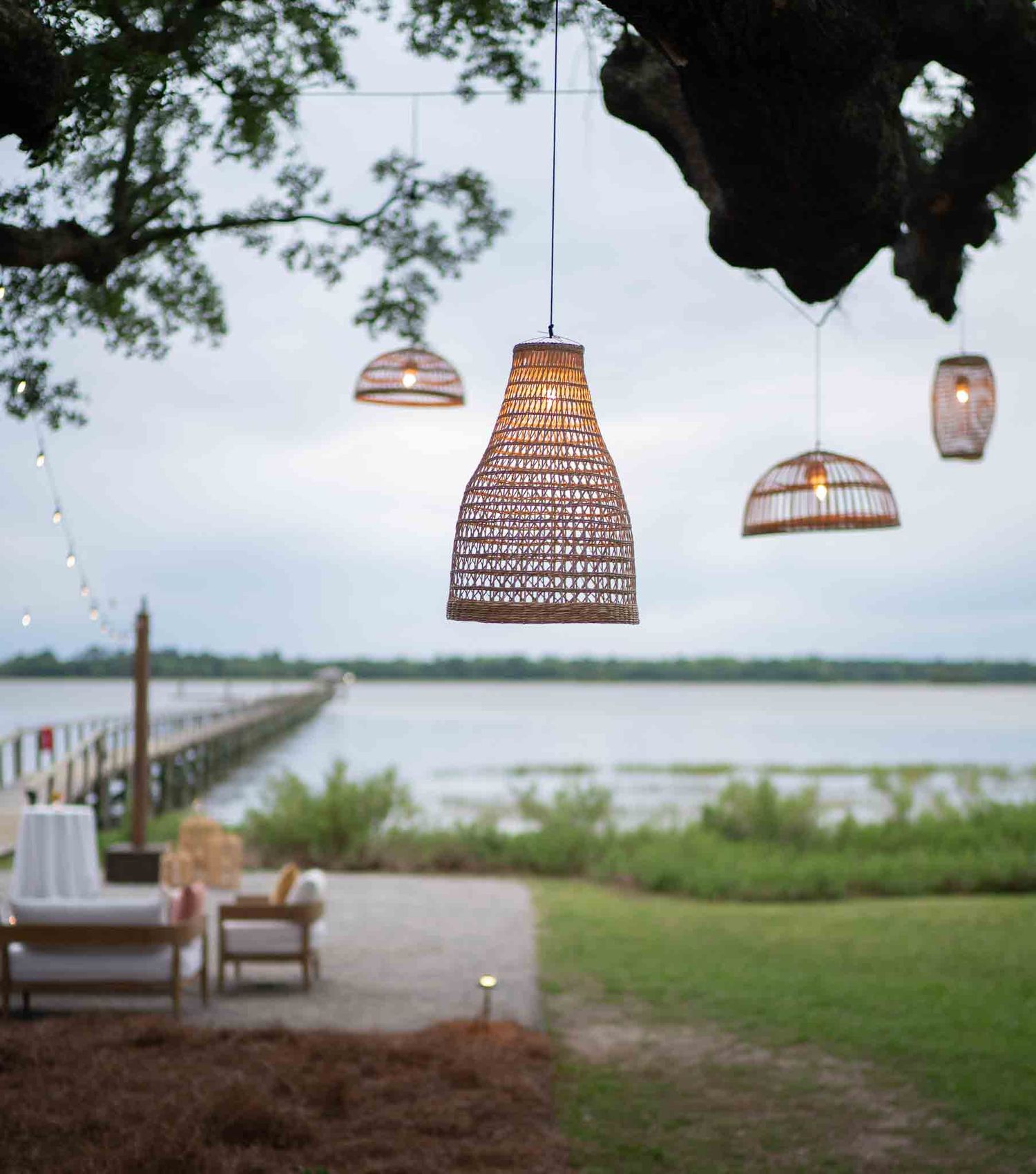 Basket lights overlooking the ocean at a wedding venue