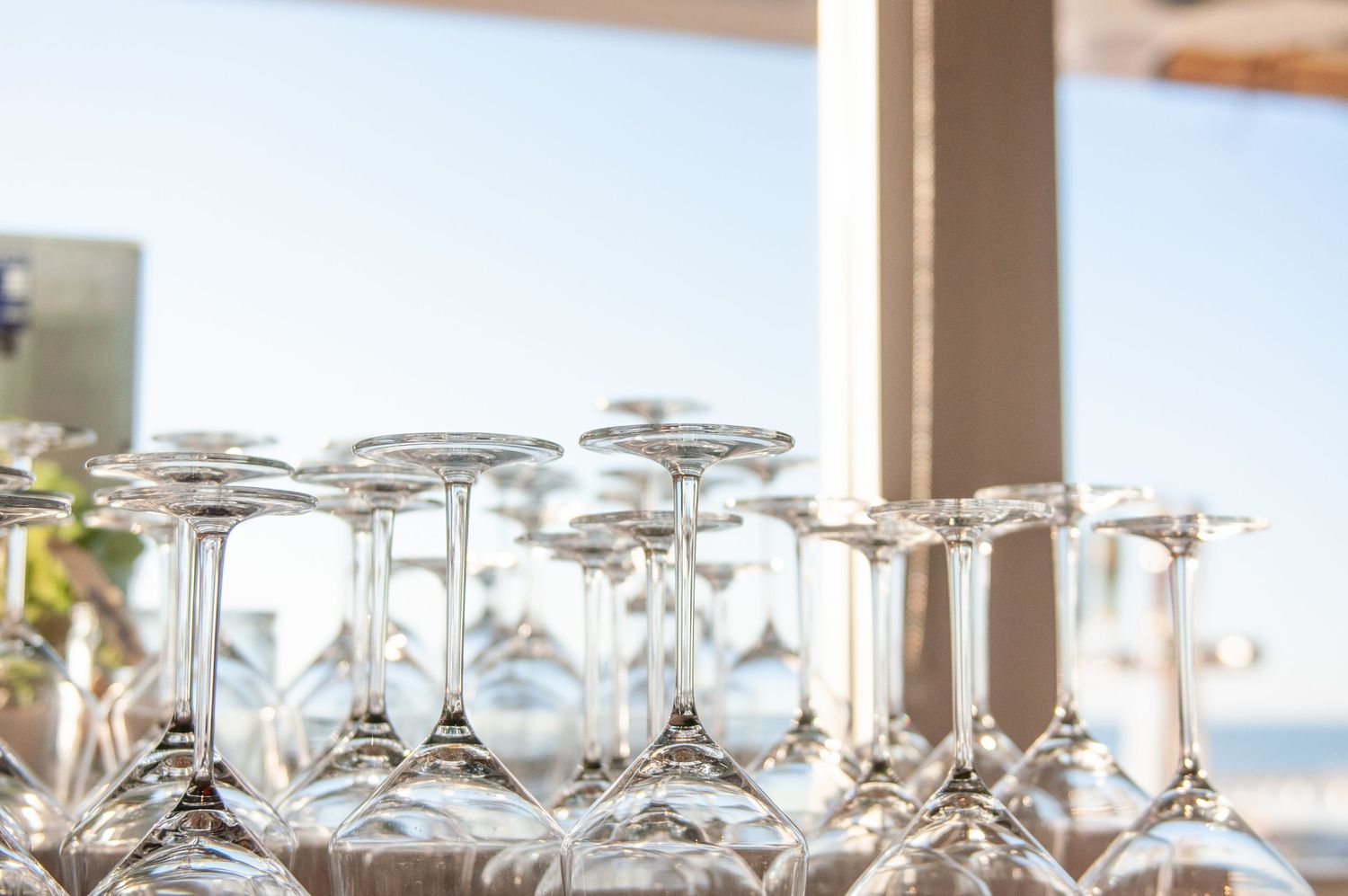 Drink glasses by a window in a restaurant space