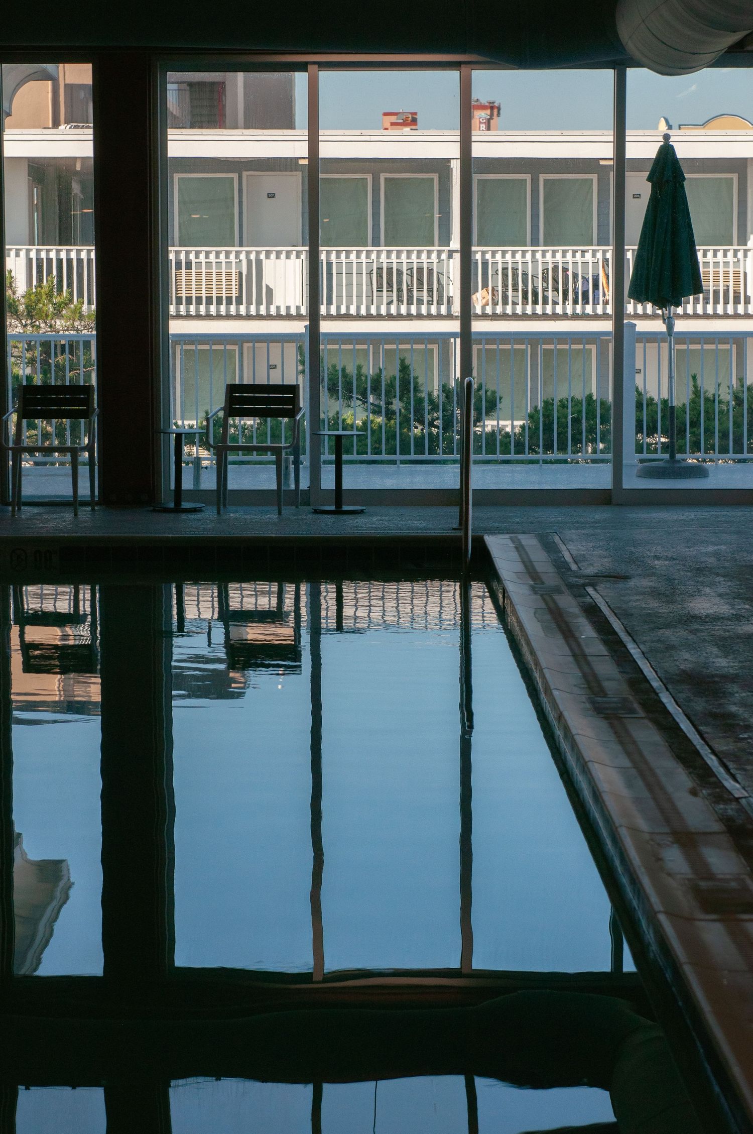 Reflection in a pool inside a resort space