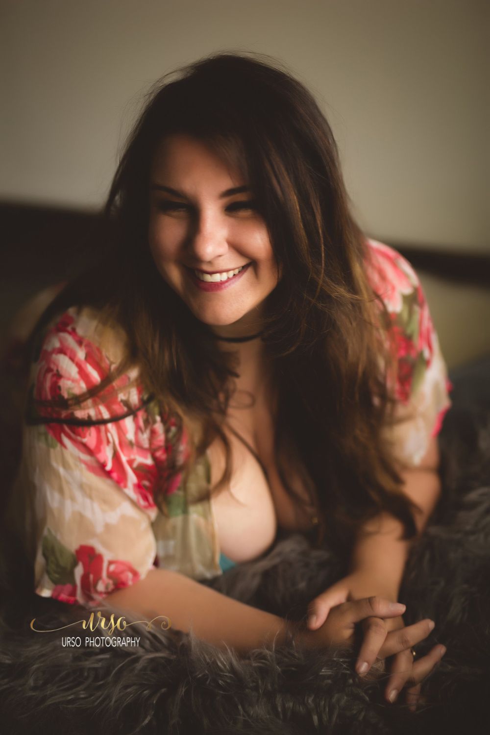 Modern and soft boudoir photography in studio by Urso Photography.