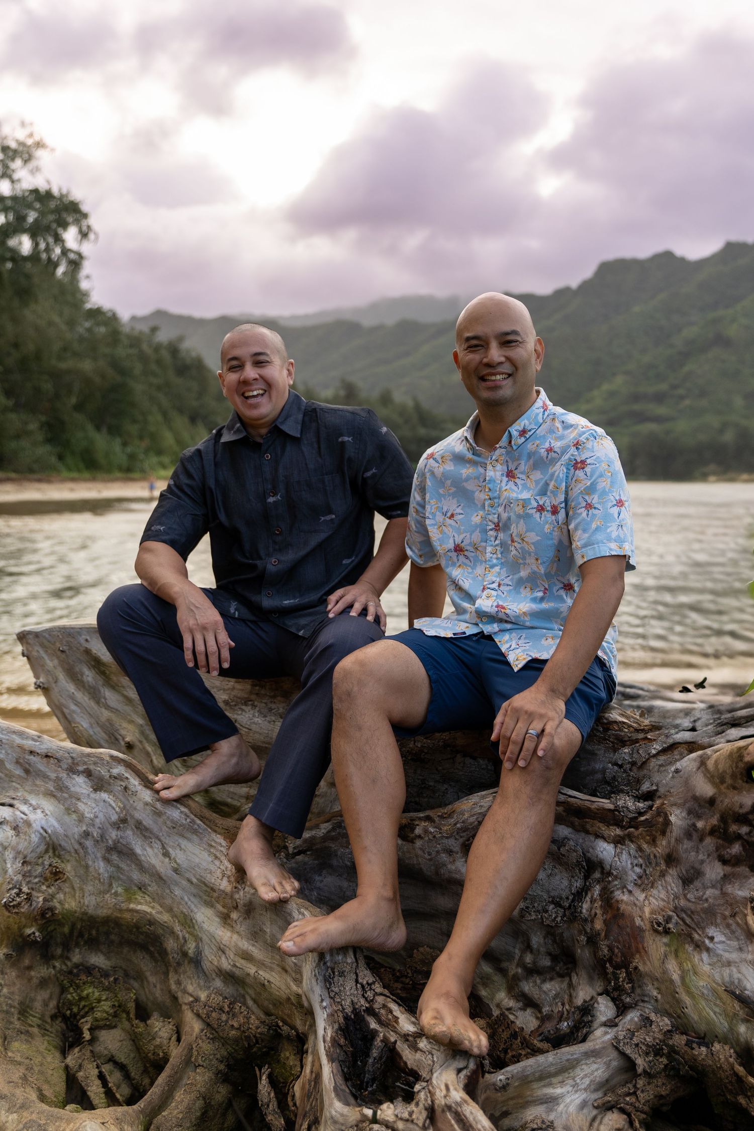 Two men standing casually at the beach during sunset — relaxed Hawaii lifestyle portrait by Live Tribe Media.