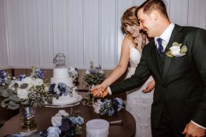 Couple sharing intimate moments during their wedding reception dinner.