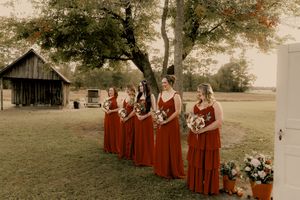 A panoramic collage of a rustic outdoor wedding scene with bridesmaids in burgundy dresses gathered near a wooden barn.