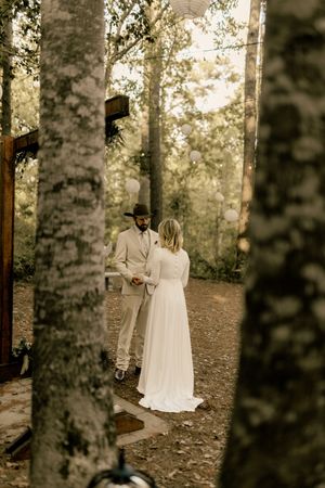 A bride and groom share a romantic moment among birch trees at a wedding in New Bern, NC. Wedding photographer.