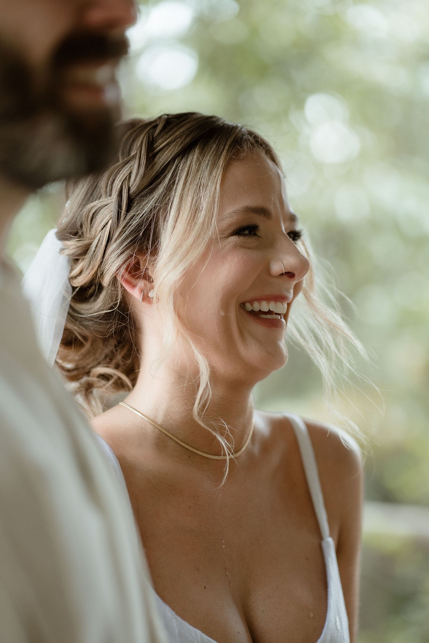An intimate candid moment captured during an outdoor wedding celebration.
