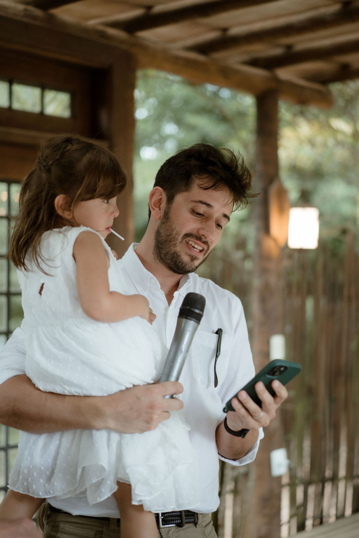 A sweet moment shared during a wedding speech as someone reads from their phone.