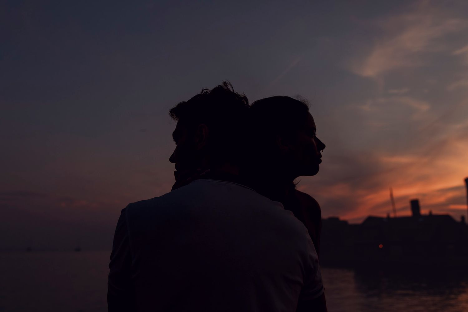 couple silhouette against a gradient sky. romantic cinematic imagery lumenali photography.