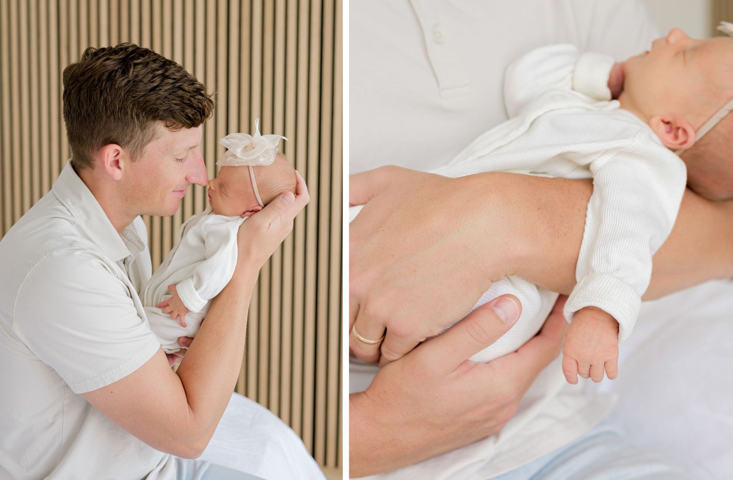 Parent in white robe holds sleeping baby tenderly on comfortable bed in soft muted lighting.