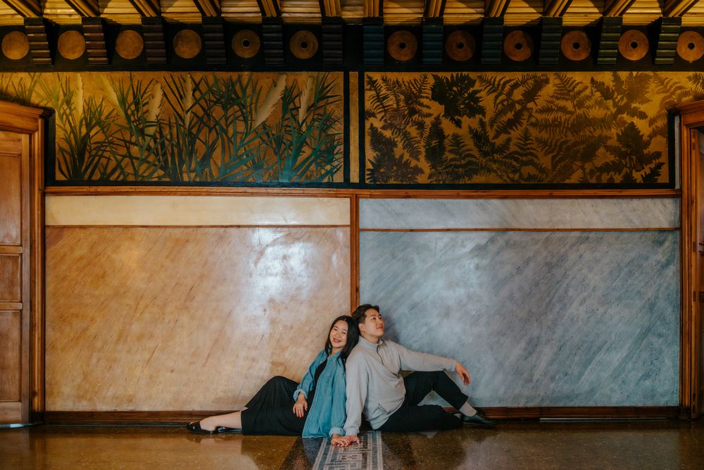 Sweet kiss under the shelter of Casa Vicens' decorated balcony.