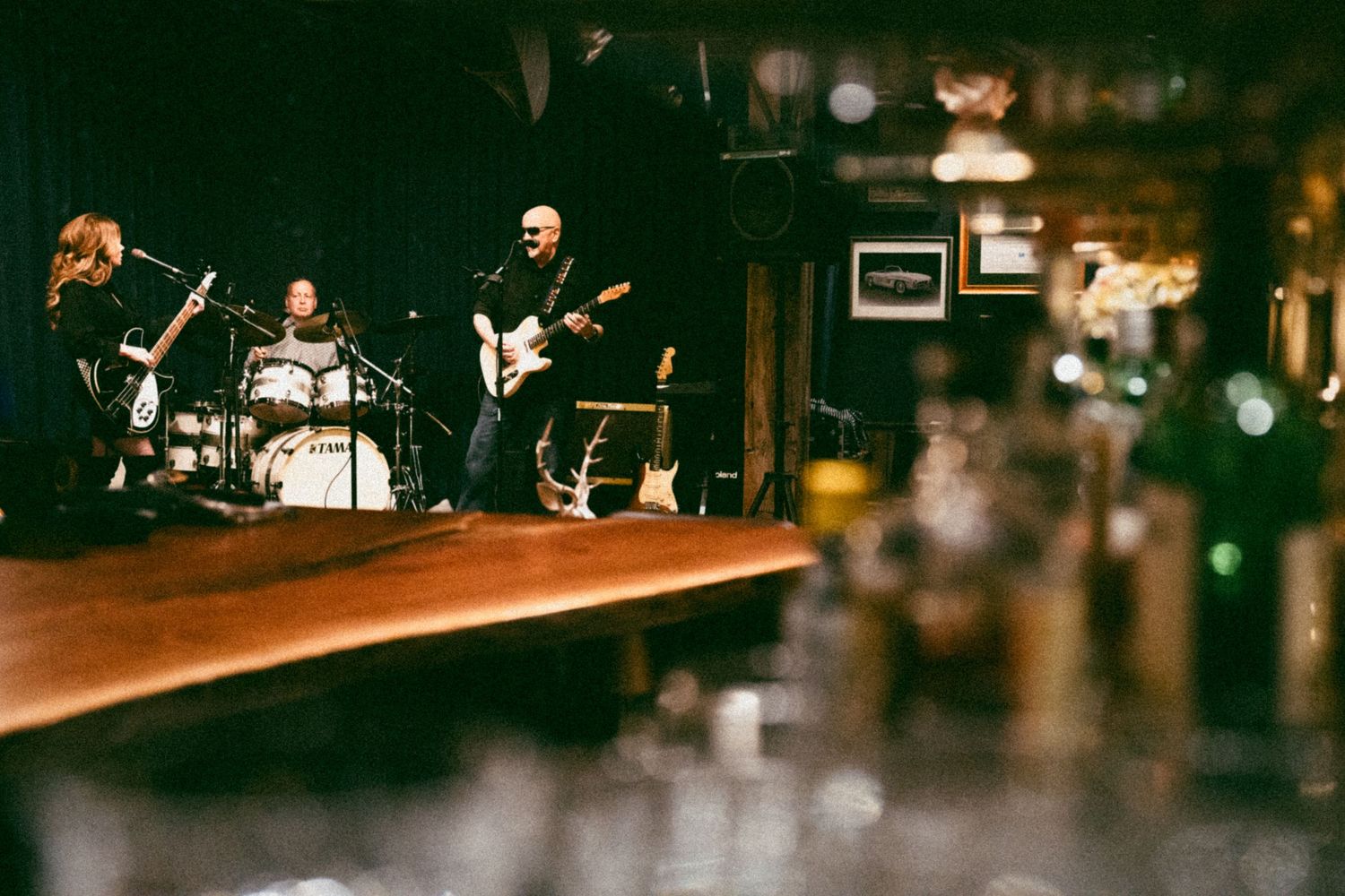 Atmospheric bar scene with bokeh lights and blurred background.