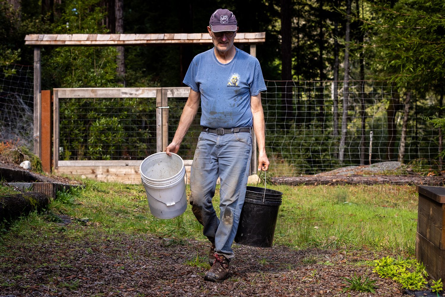 Dr. Robin Serrahn lifestyle portrait working in his garden in Mendocino, CA