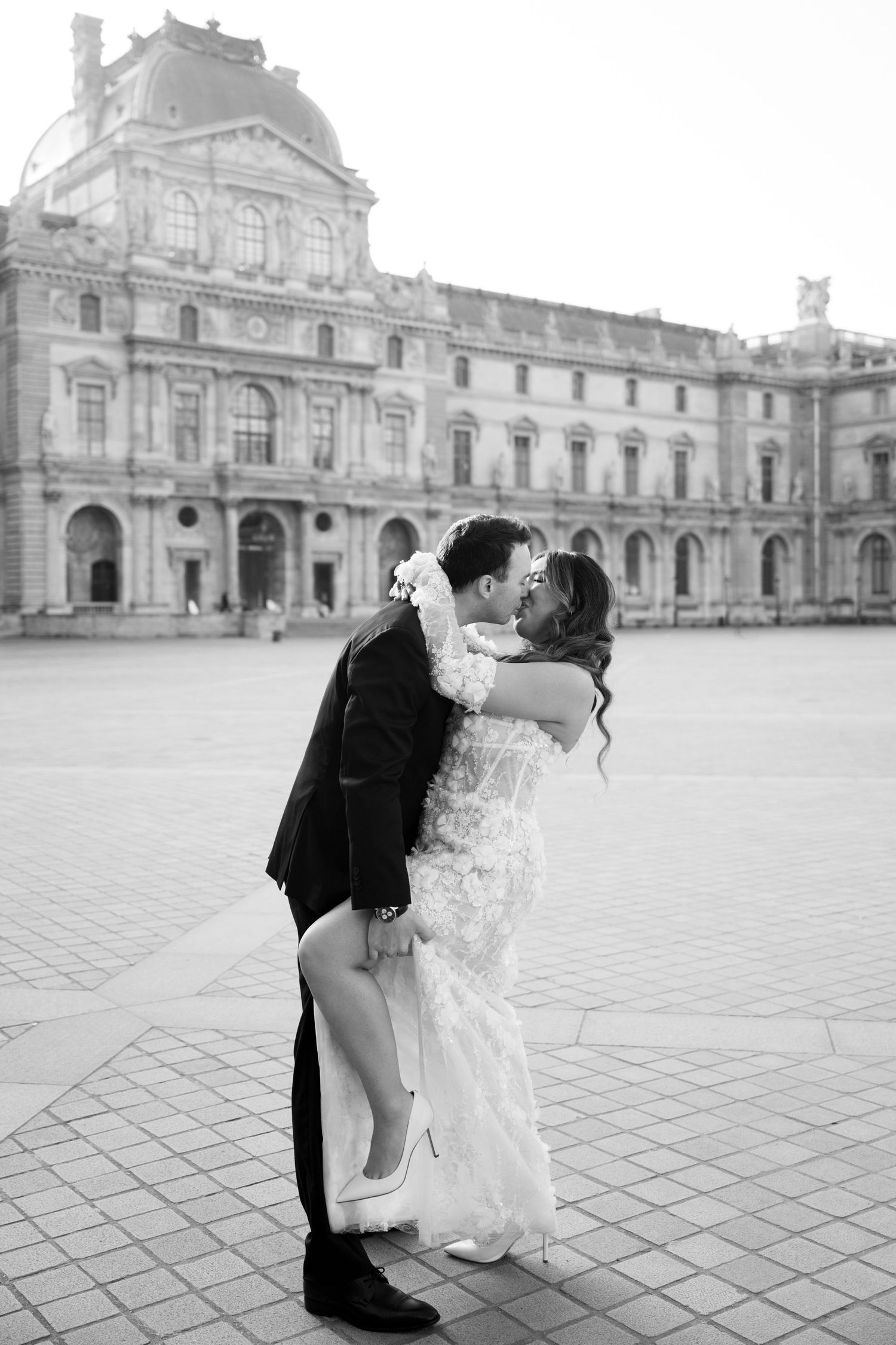 A romantic proposal moment overlooking a coastal mountain landscape with misty views of the Mediterranean Sea below.