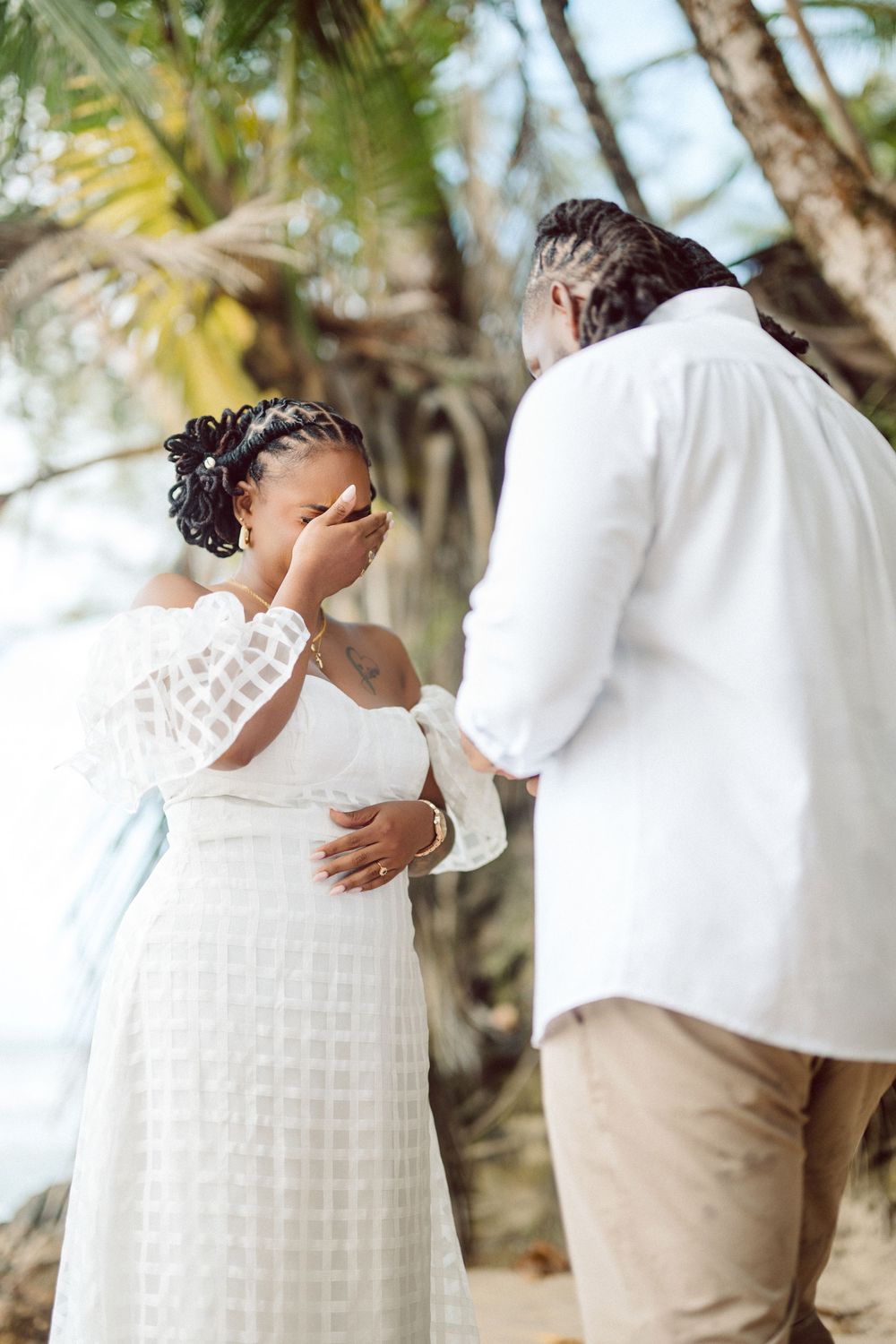 A series of intimate wedding photos showing a couple in white and khaki embracing outdoors among palm trees at a beach ceremony.