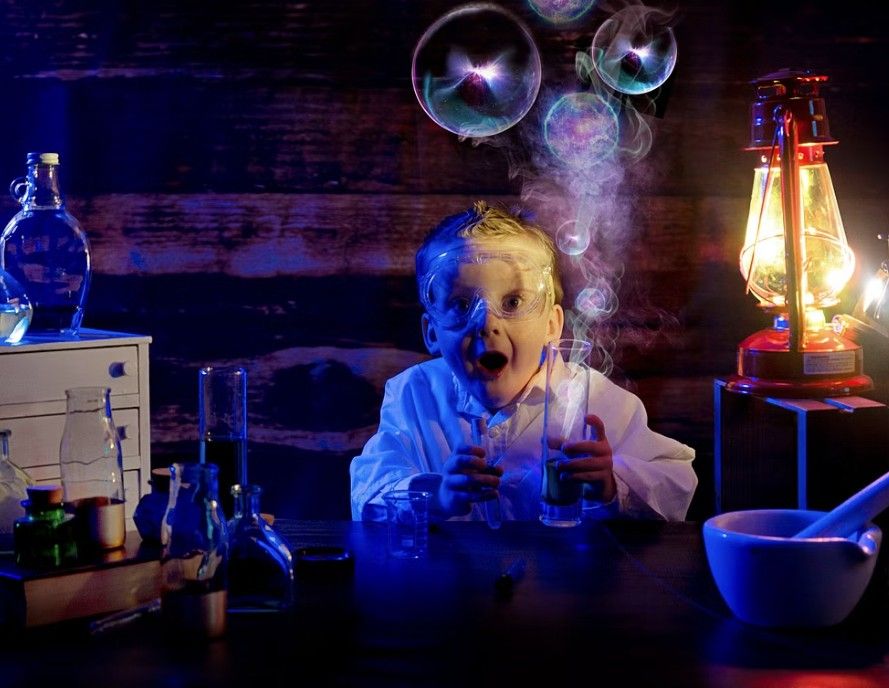 A glowing science lab setup with dramatic lighting features bubbling beakers, smoke rings, and a vintage lantern in blue tones.
