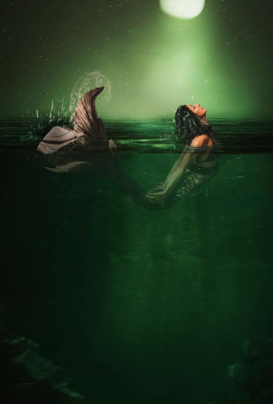 A dreamlike sequence shows graceful movements underwater illuminated by an ethereal green moonlight against a dark sea.