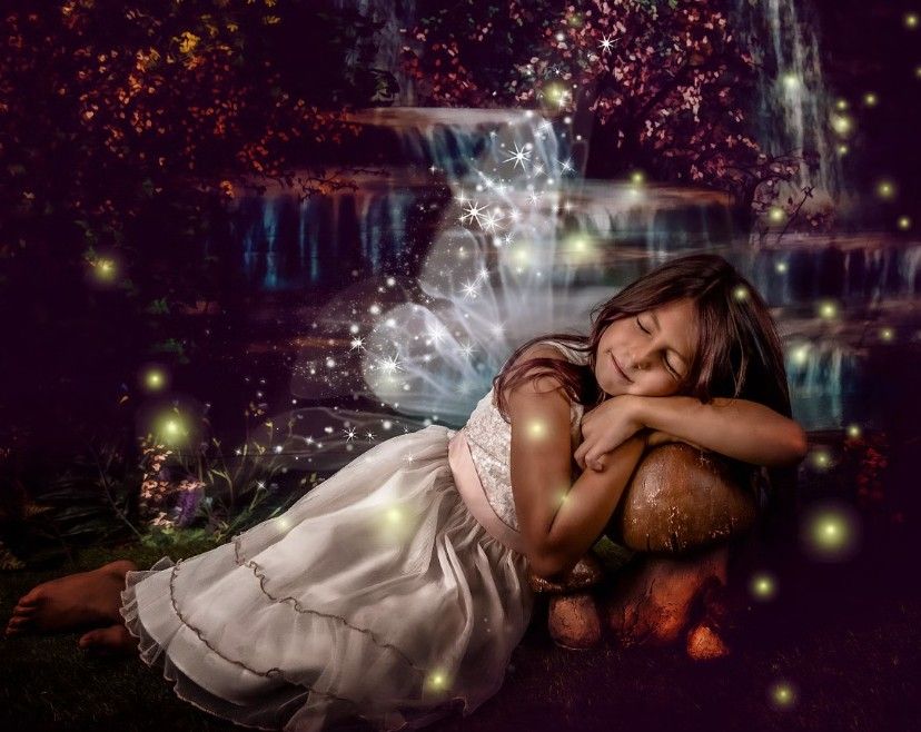 Fantasy portrait series with dreamy sparkles and magical lighting effects in a dark setting.