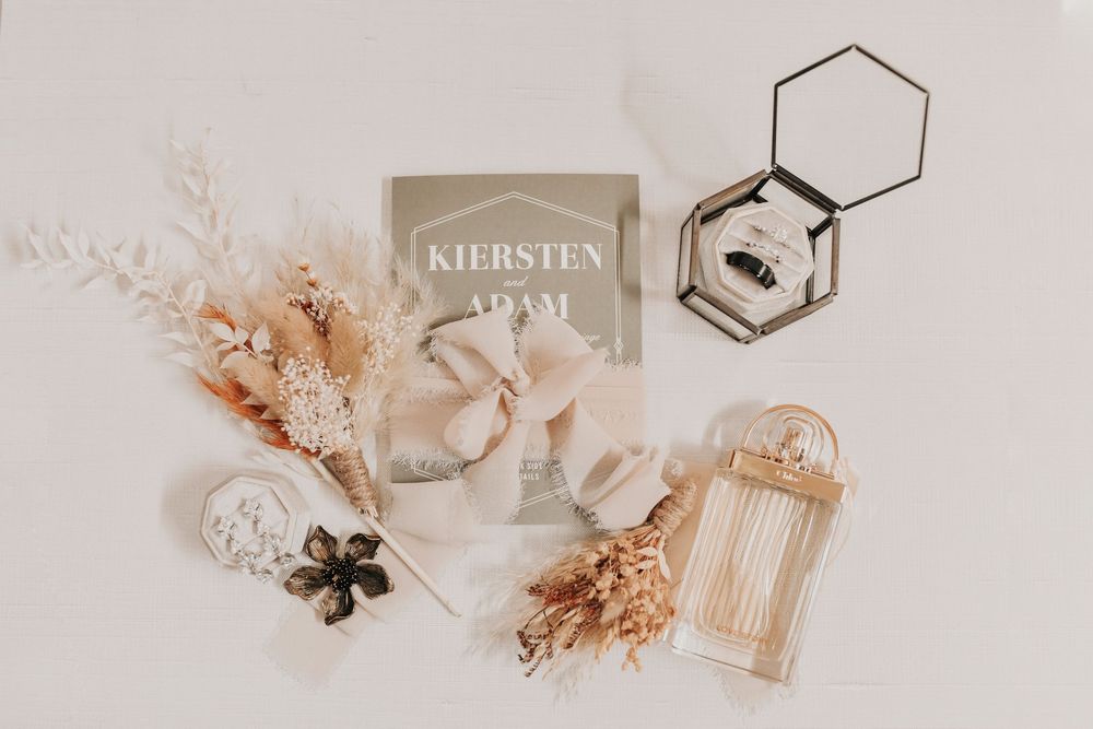 Romantic rustic bridal details including heirloom jewelry and greenery accents