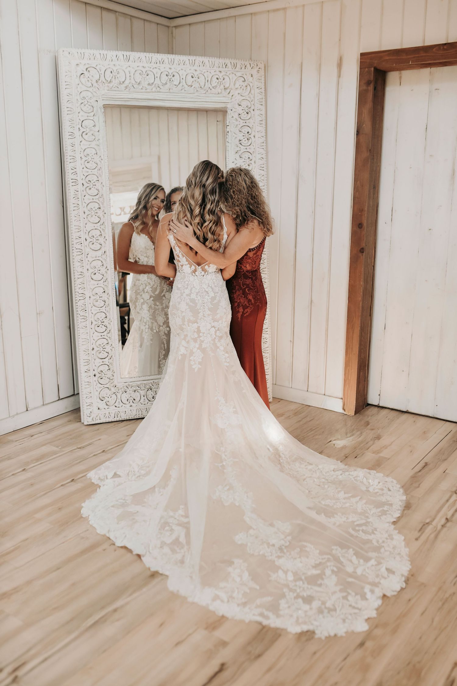 Candid bridal getting ready photo with her mom with soft natural light