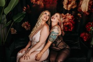 Studio portrait collage showing joyful couple embracing & sharing intimate moments against dark floral backdrop. Grand Rapids Boudoir Studio