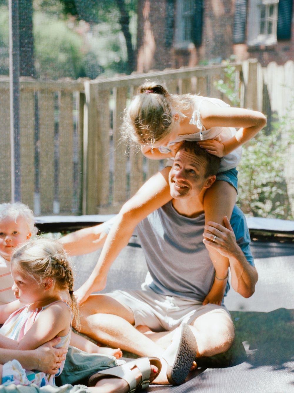 Candid moments of family playtime captured in a sequence of joyful interactions.