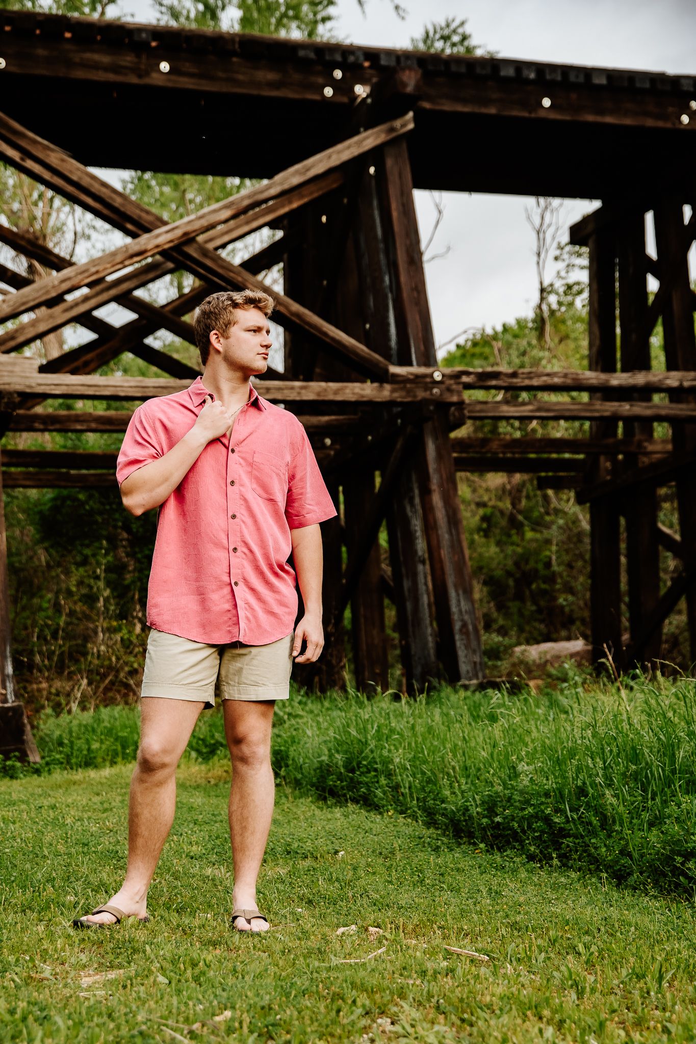 High school senior boy posing outdoors during spring session with Austin photographer