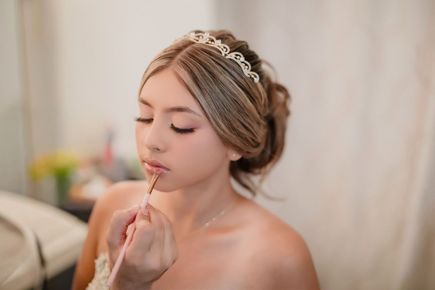 Close-up details of wedding day preparations show delicate jewelry and soft makeup.