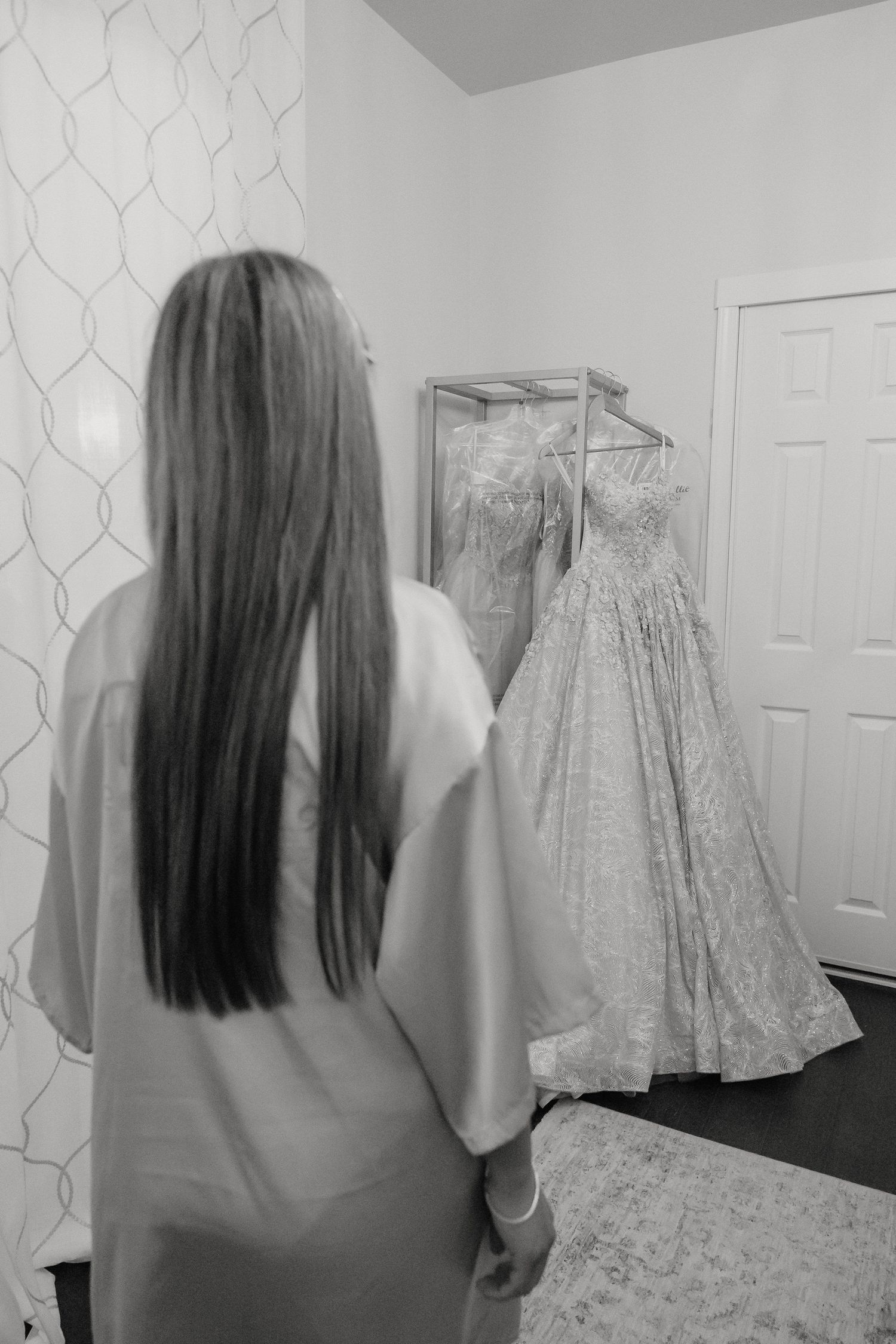 Quinceanera gets ready with her dress on display for Bella Vista quince celebration