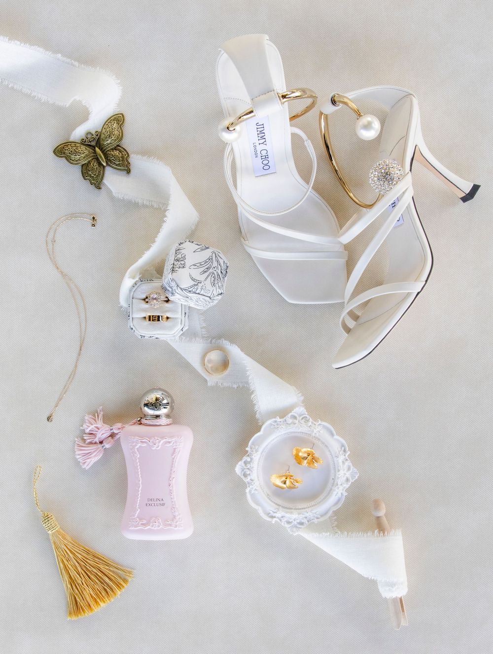 Flatlay of rings and invitation suite at an Austin Texas Wedding.