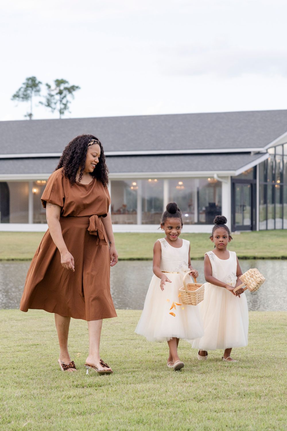 Flower girls entering during San Antonio wedding ceremony, true-to-life photography