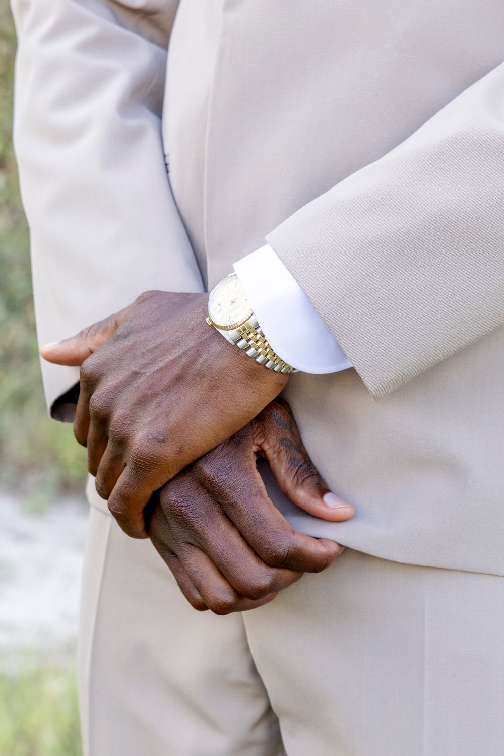 Groom putting on cufflinks, editorial and timeless San Antonio wedding photographer