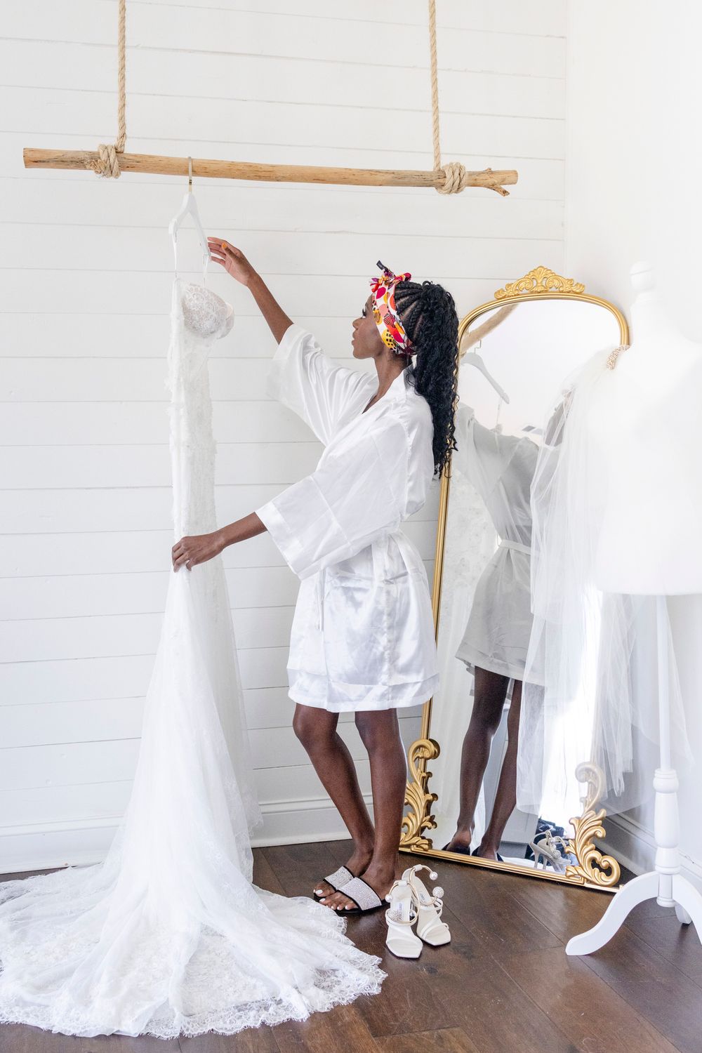 Bride’s wedding gown hanging in elegant room, Austin luxury wedding photography
