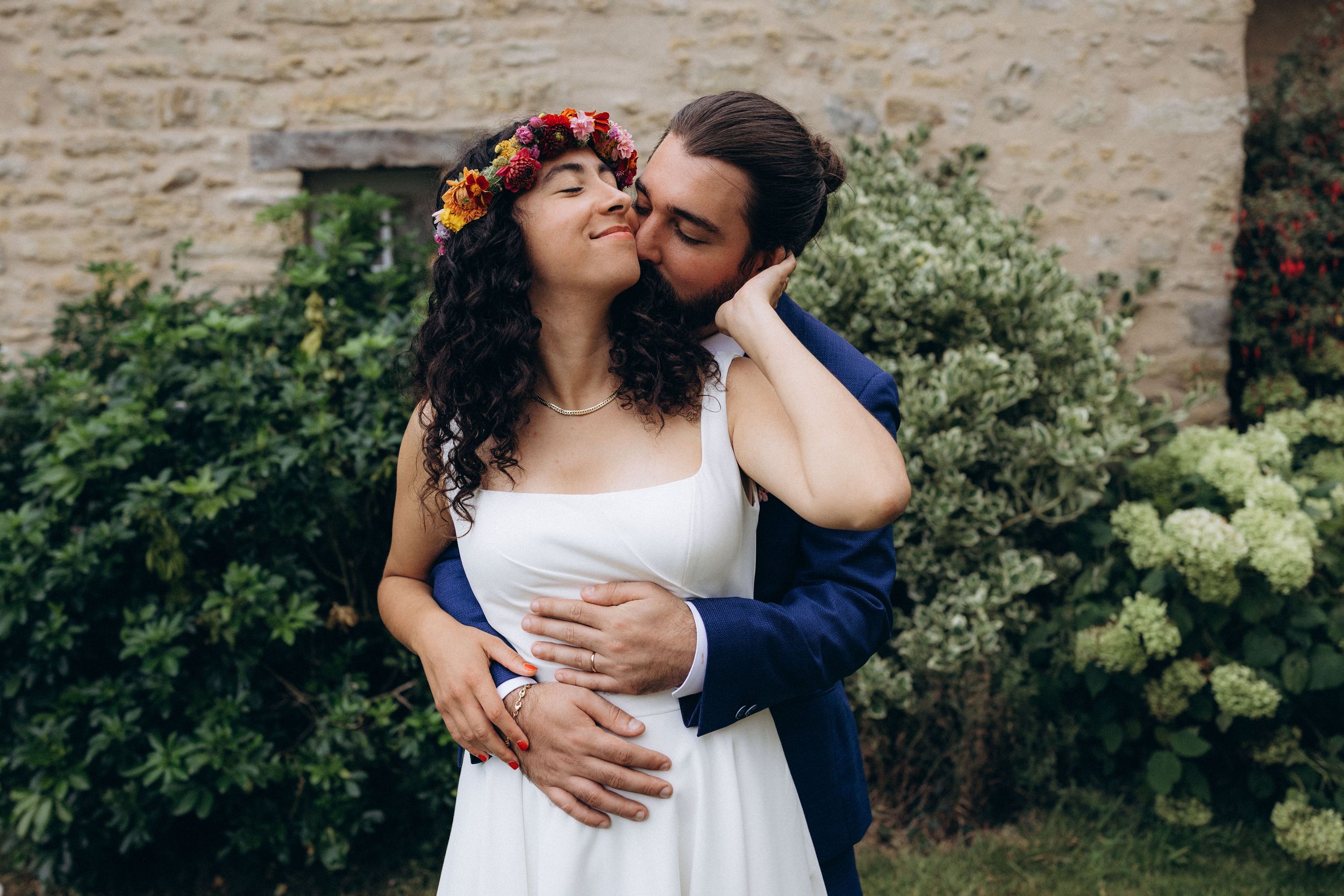A romantic dance silhouette under stone archways with warm lighting.