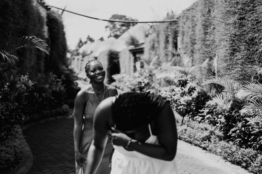 Black and white portrait in garden setting with natural lighting.