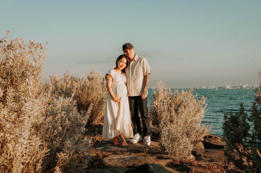 A maternity photo session on the beach with golden shrubs and path, in soft sunlight.
Altona Maternity Photographer Melbourne