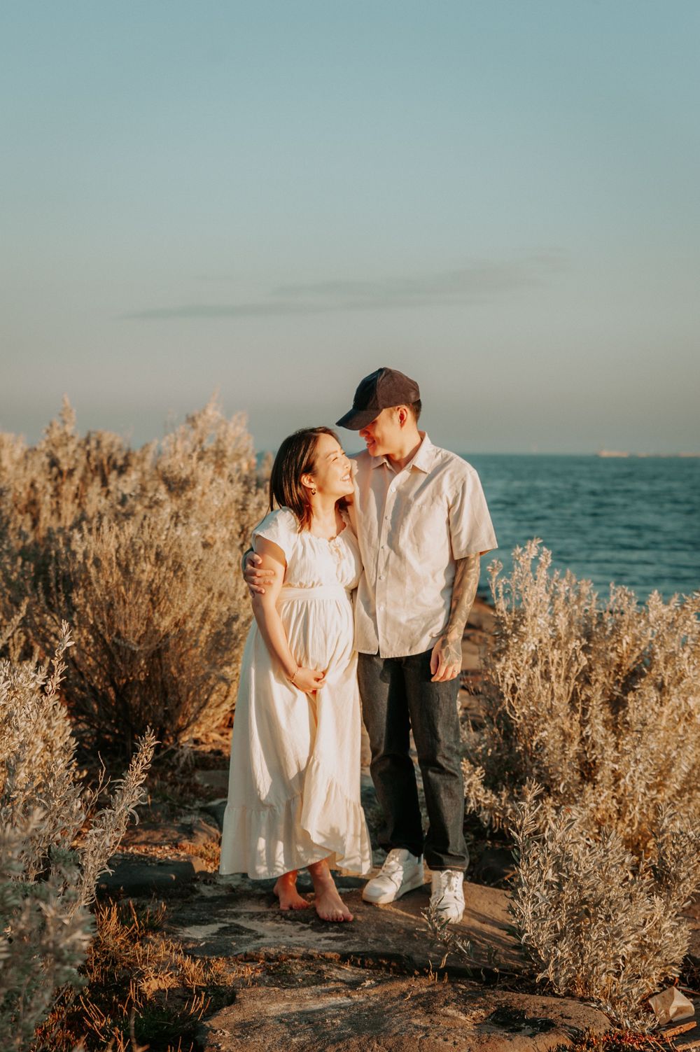 A maternity photo session on the beach with golden shrubs and path, in soft sunlight.
Altona Maternity Photographer Melbourne