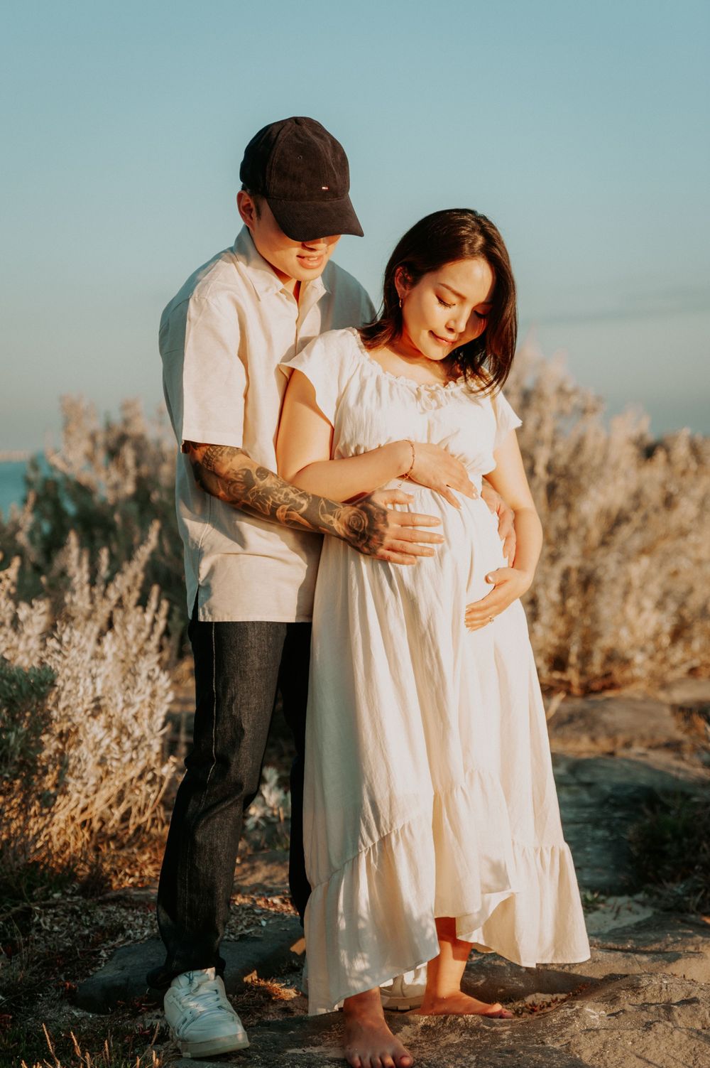 A maternity photo session on the beach with golden shrubs and path, in soft sunlight.
Altona Maternity Photographer Melbourne