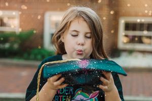 Looking down at a sparkly surface with glitter and wonder.