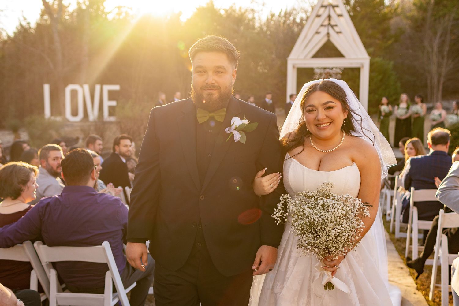 Motion blur of people dancing in circle at outdoor wedding event in Oklahoma