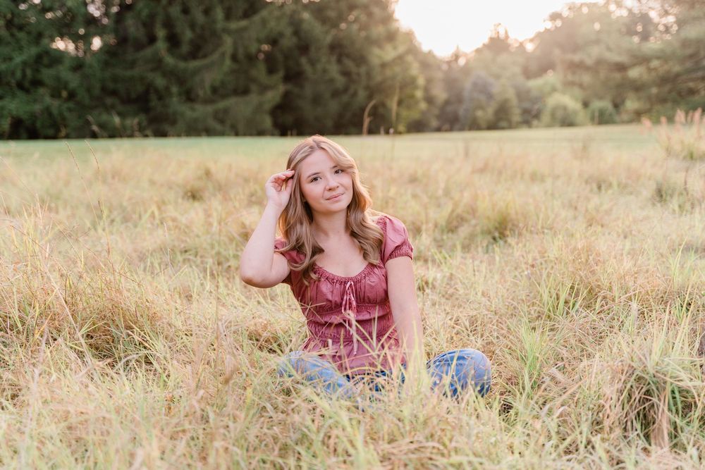 High school senior photographed in golden hour light