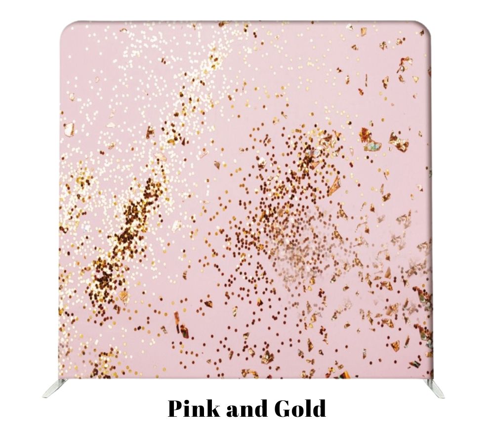Pink background with scattered metallic gold glitter flakes creating an elegant and festive texture.