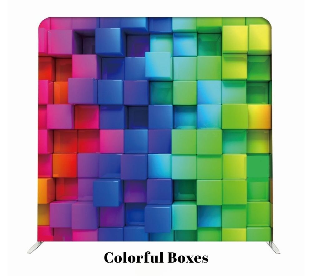 A vibrant 3D grid of colorful cubes arranged in a rainbow pattern with protruding blocks creating depth and texture.