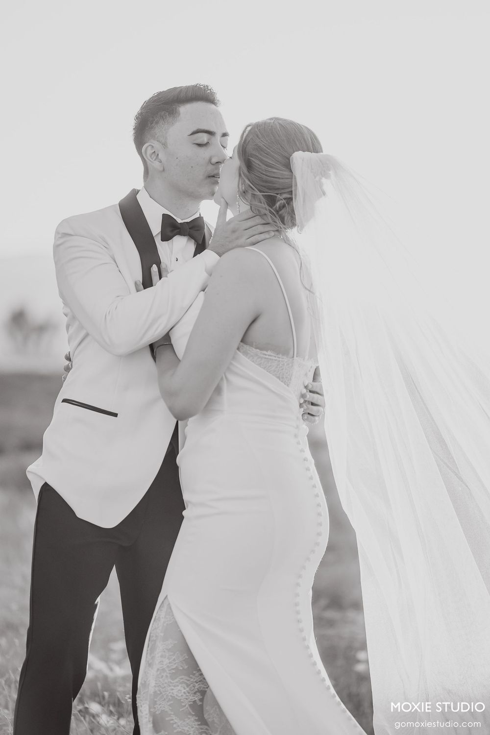 Black and white romantic wedding portraits showing tender moments between newlyweds.