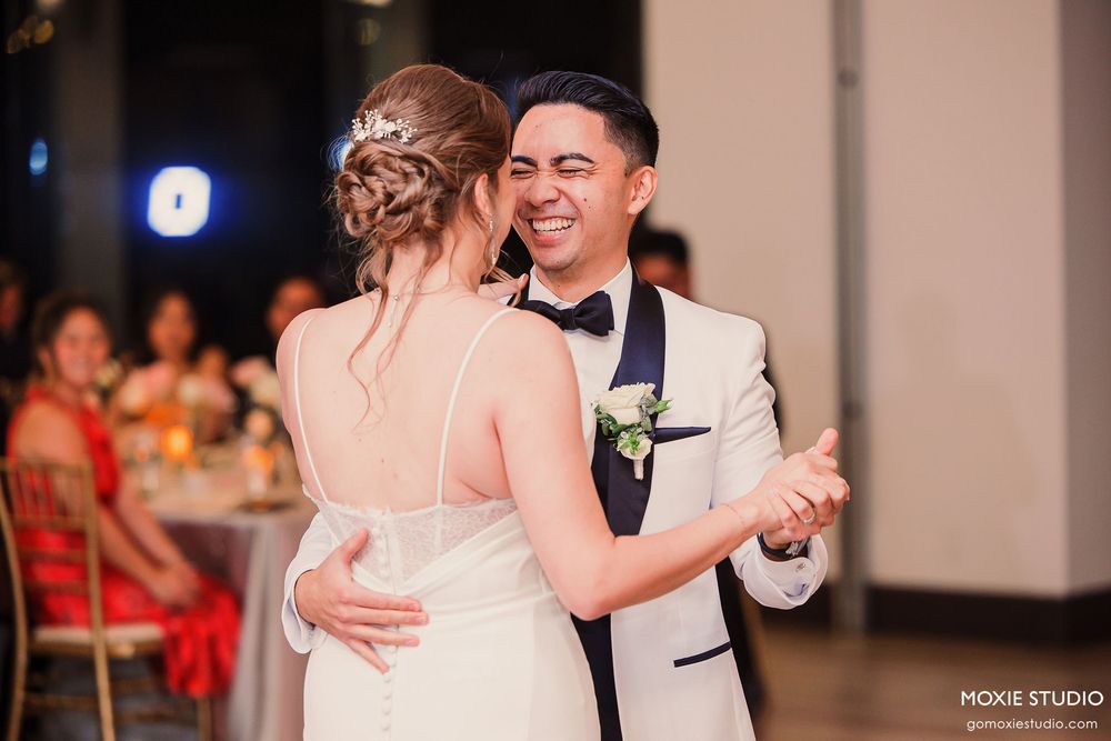 Couples sharing romantic dances on the reception floor under warm lighting.