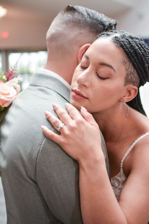 Close-up shots of tender moments between newlyweds in formal wedding attire.