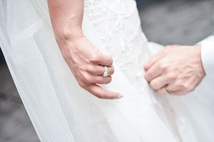 Detail shot of wedding dress lace and delicate veil texture.