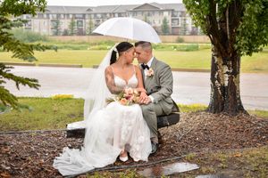 A romantic wedding couple shares intimate moments under umbrellas on a rainy day across multiple photos.