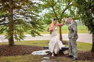 Wedding couple portraits under tree canopy in outdoor setting.