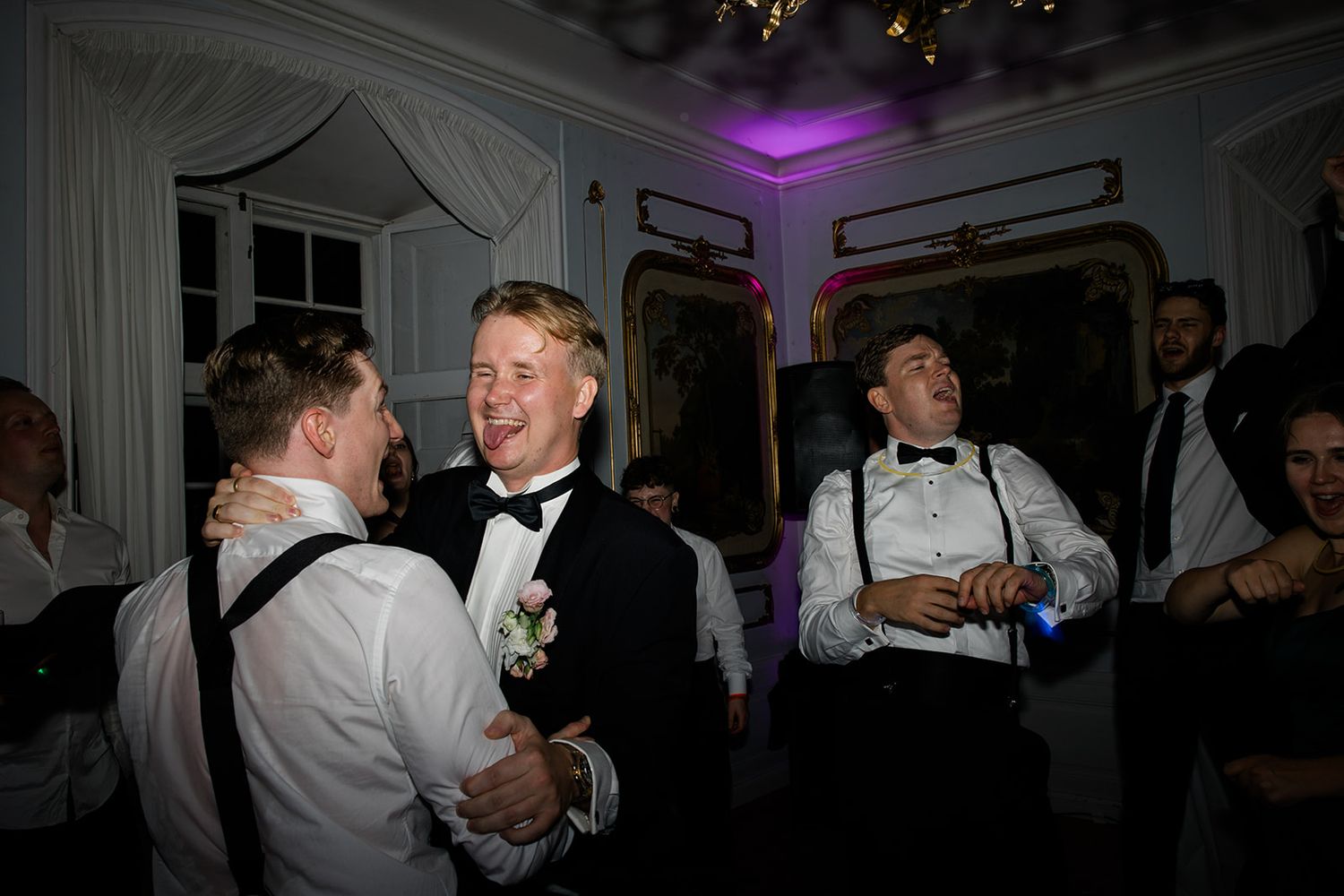 Black and white photos show people dancing and socializing at what appears to be a formal event or celebration.
