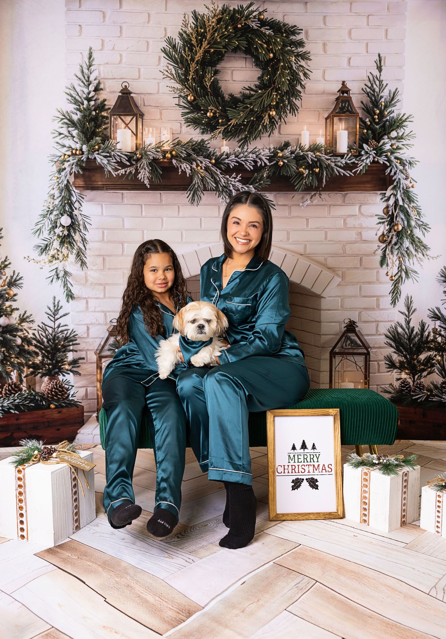 Five cozy holiday photos show people in matching teal outfits sitting by a decorated white brick fireplace with wreaths and lanterns.